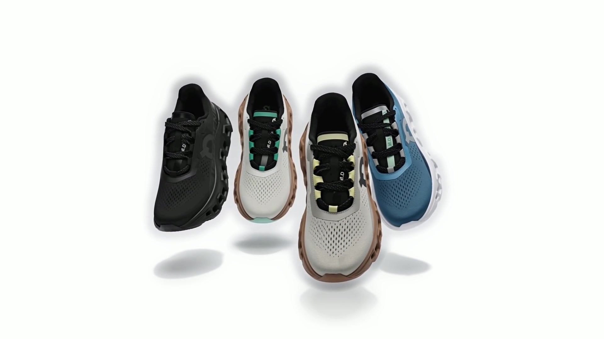 Les chaussures posées côte à côte : noire, blanche et brune, bleue